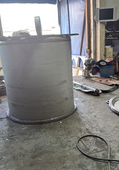 A fabricated cylindrical vessel shell in the workshop